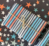 Giftwrap - Multi coloured stripes on blue (WR61)